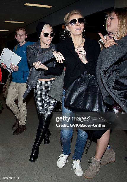 Miley Cyrus and her mother Tish Cyrus are seen at Los Angeles International Airport on February 15, 2013 in Los Angeles, California.