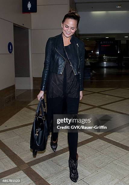 Christine Teigen is seen at Los Angeles International Airport on February 15, 2013 in Los Angeles, California.