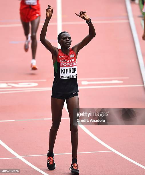Helah Kiprop of Kenya celebrates after crossing the finish line to win silver in the Women's Marathon final during the '15th IAAF World Athletics...