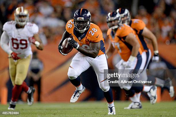 Montee Ball of the Denver Broncos runs after making a catch on a ball thrown by Brock Osweiler against the San Francisco 49ers during the second half...