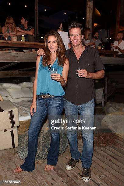 Cindy Crawford and Rande Gerber attend Kelly Slater, John Moore and Friends Celebrate the Launch of Outerknown at Private Residence on August 29,...