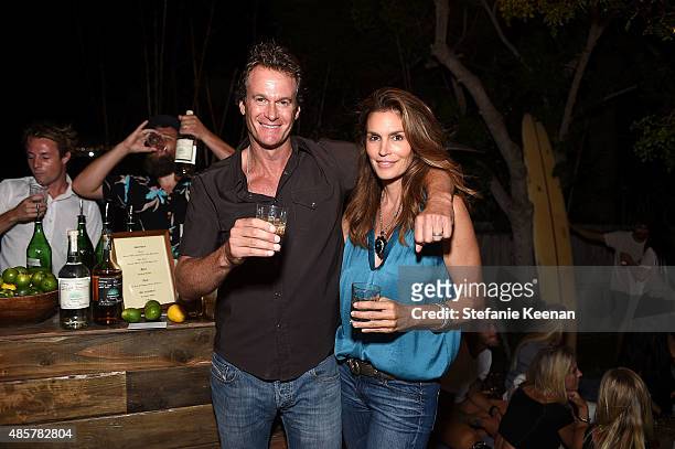 Rande Gerber and Cindy Crawford attend Kelly Slater, John Moore and Friends Celebrate the Launch of Outerknown at Private Residence on August 29,...