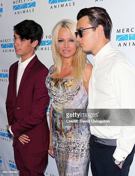Actress Pamela Anderson poses with sons Dylan Jagger Lee and Brandon Thomas Lee at the Hidden Heroes Gala presented by Mercy for Animals at Unici...