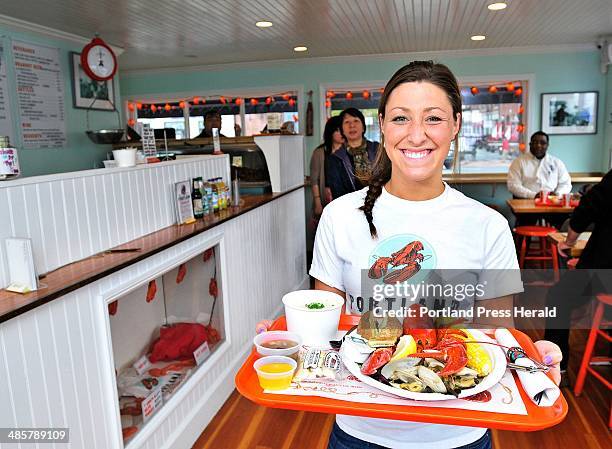 Gabe Souza/Staff Photographer -- Photographed on Monday, May 23, 2011 -- Waitress Kara Maxsimic serves up a Downeast Feast at the Portland Lobster...