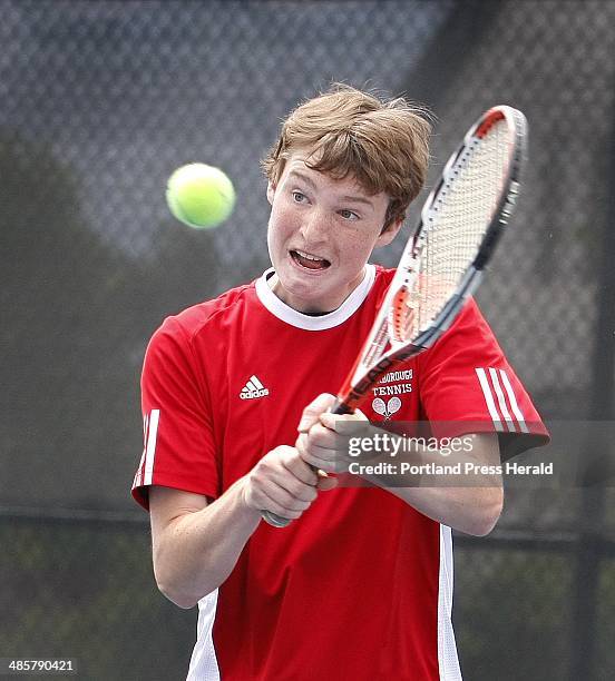 Jill Brady/Staff Photographer: Jeff Sirocki of Scarborough sends one over during his doubles match with Joe Corbeau against Lewiston Saturday, June...