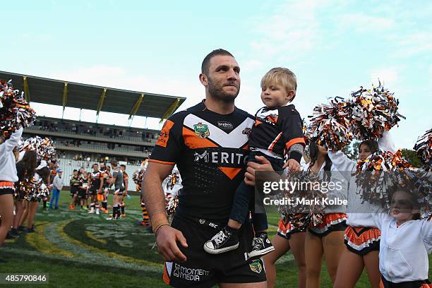 Robbie Farah of the Wests Tigers leaves the field after the Tigers last home game of the season during the round 25 NRL match between the Wests...