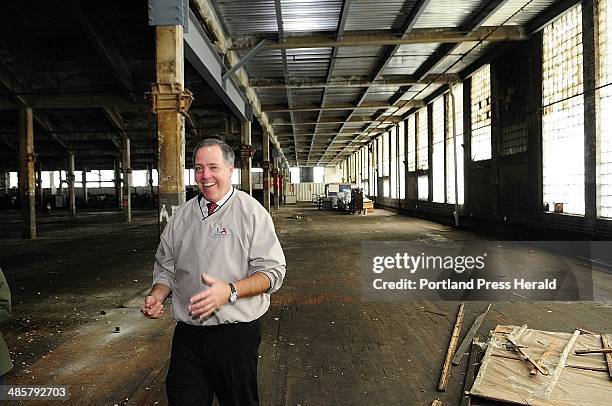 Staff photo by Joe Phelan -- Lewiston city official Lincoln Jeffers leads a tour of the Bates Mill No. 5 in Lewiston, the proposed site of a casino.