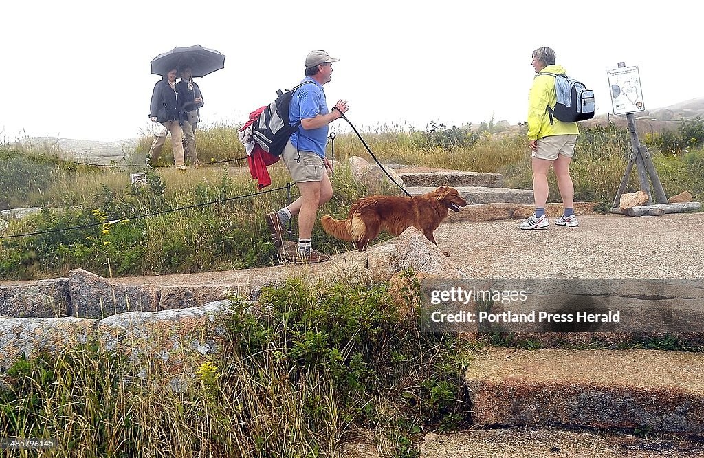 Macgregor and Valerie Grant of St. John, New Brunswick, Canada, walk the granite walkways of Cadill