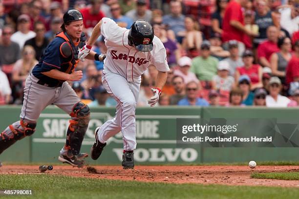 Carl D. Walsh/Staff Photographer: Portland Sea Dogs right fielder Mitch Denning hustles to first as Binghamton Mets' catcherKai Gronauer chases the...