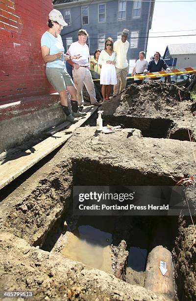 Tim Greenway/Staff Photographer: Archeologist Martha Pinello, far left, discusses the excavation of historic Abyssinian Meeting House where they...