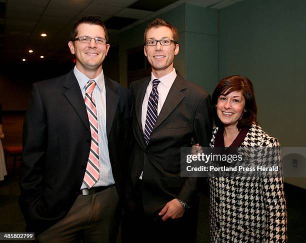 Tim Greenway/Staff photographer -- - Jim Chalmers of Falmouth, left, Nick Morrill of Portland and his wife Dorian Cole during the Pine Tree Council,...