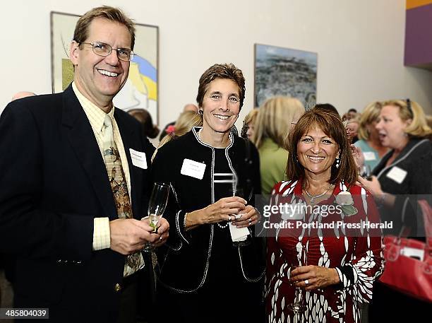 Photo by Gordon Chibroski, Staff Photographer -- Andrew Geoghegan, left, Gloria Pinza and Kathie Leonard, an award recipient. --
