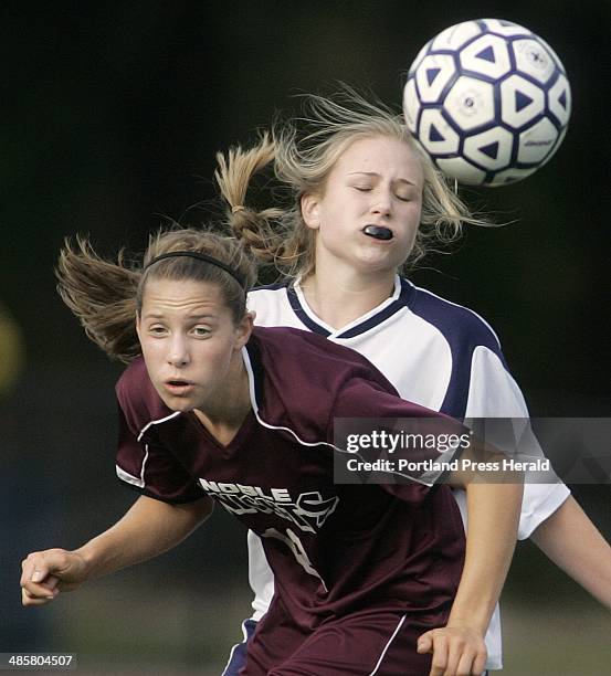 Staff Photo by Derek Davis: Tricia Reinken of Noble wins a header in front of Portland's Casey Hart during action at Fitzpatrick Stadium....