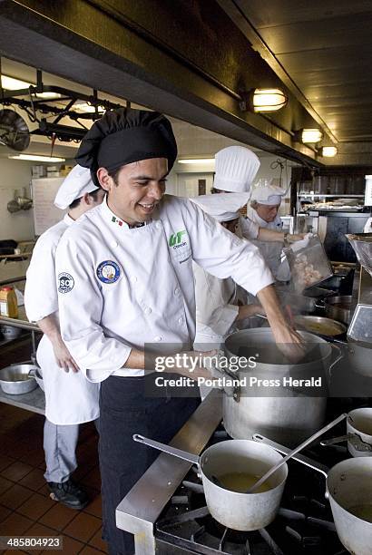 Jack Milton/Staff Photographer: Sheldon Cruz, and exchange student from Cancun, Mexico, at Southern Maine Community College, makes risotto in the...