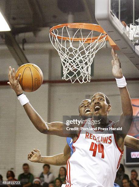 Jill Brady/Staff Photographer: -- Alexis Ajinca of the Maine Red Claws gets inside against DeVon Hardin of the Tulsa 66ers during Maine's 87-82...