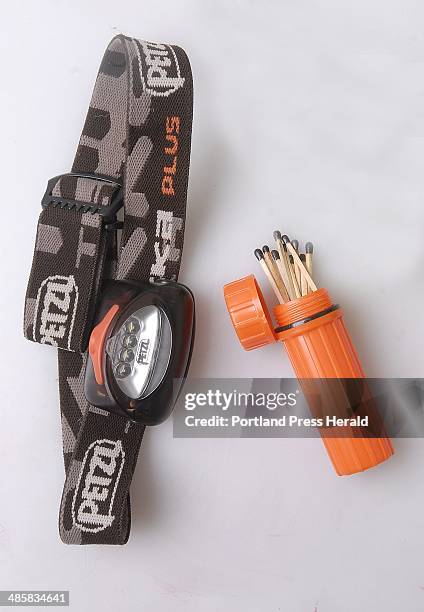 Doug Jones/staff photographer: -- Monday, April 6, 2008: Headlamp and waterproof matches in waterproof container for OutDoors piece on emergency gear...