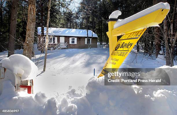 Doug Jones/Staff Photographer, Tuesday, January 27, 2009: Julie Bayley's agents in Waterboro are prepared to show the vacant homes in the Lake...