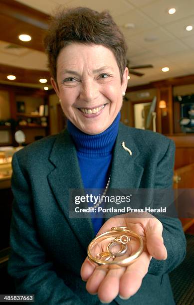 John Patriquin/ Staff Photographer: Monday, January 2009. Judy Brown displays some gold jewelry, including bracelet and rings, customers bring into...