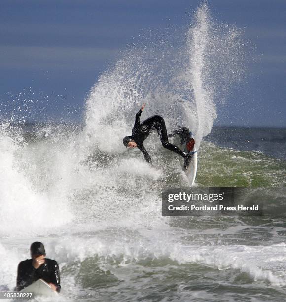 Staff Photo by Derek Davis: Nico Evans of Cape Neddick spins on a wave while surfing at Short Sands beach in York. Photographed on Thursday, Oct. 14,...