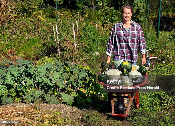 Photo by Gordon Chibroski, Staff Photographer. Tuesday, September 23, 2008. Tracy Weber of North Yarmouth wheels a load of freshly picked Blue...