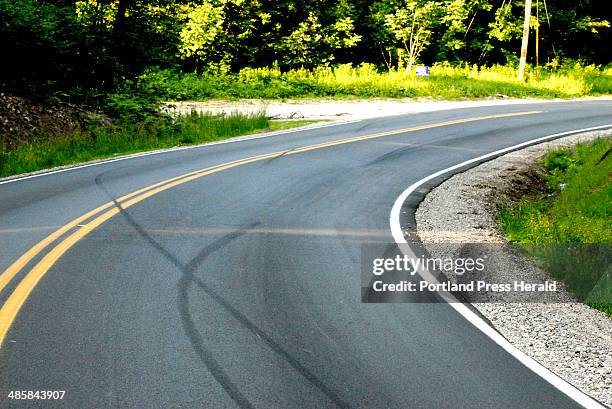 John Patriquin/Staff Photographer -- Skid marks are all that remain Monday at the scene of a fatal motorcycle accident in Naples where Route 114...