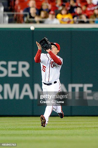 Nate McLouth of the Washington Nationals makes a catch against the St. Louis Cardinals at Nationals Park on April 18, 2014 in Washington, DC.