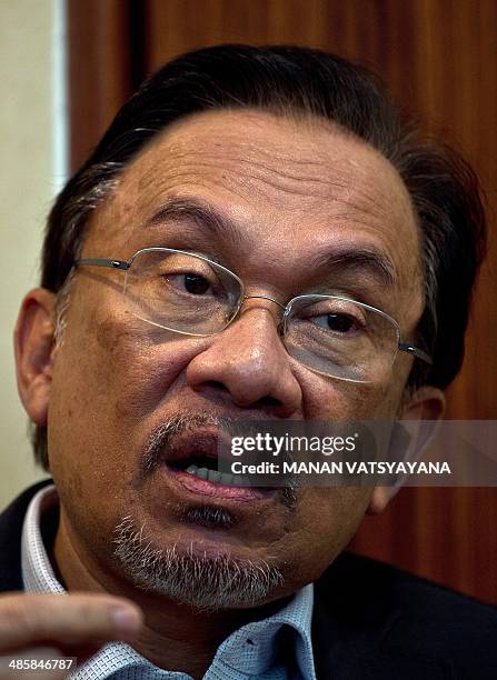 To go with AFP Story Malaysia-politics-Anwar-aviation, Focus by Shannon Teoh In this picture taken on April 9, 2014 Malaysian opposition leader Anwar...