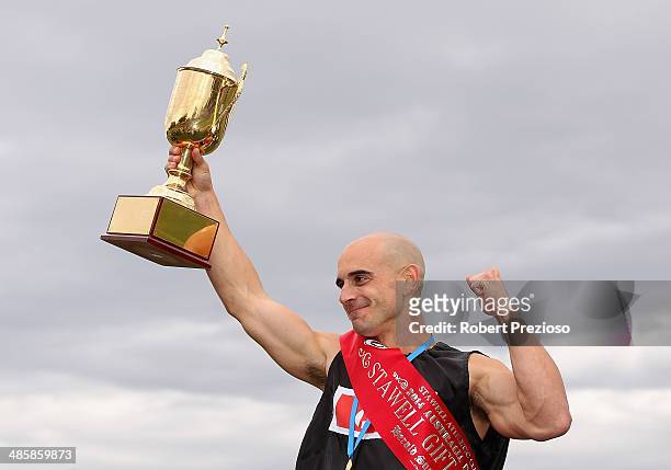 Luke Versace celebrates after winning the Australia Post Stawell Gift 120 Metres Final during the 2014 Stawell Gift meet at Central Park on April 21,...
