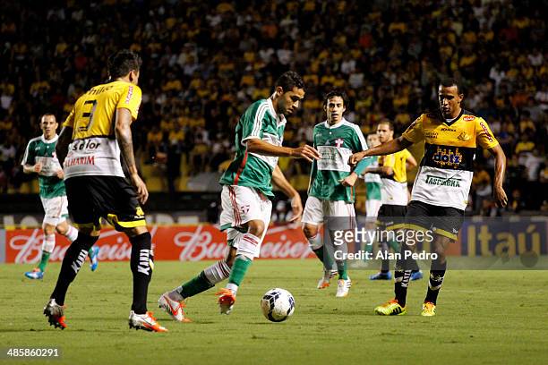Alan Kardec of Palmeiras struggles for the ball with players of Criciuma during a match between Criciuma and Palmeiras as part of Brazilian Serie A...