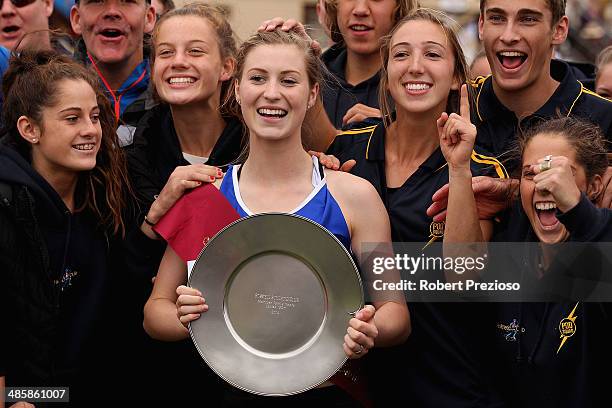 Holly Dobbyn celebrates after winning the State Victoria Strickland Family Women's Gift 120 Metres Final during the 2014 Stawell Gift meet at Central...