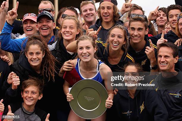 Holly Dobbyn celebrates after winning the State Victoria Strickland Family Women's Gift 120 Metres Final during the 2014 Stawell Gift meet at Central...