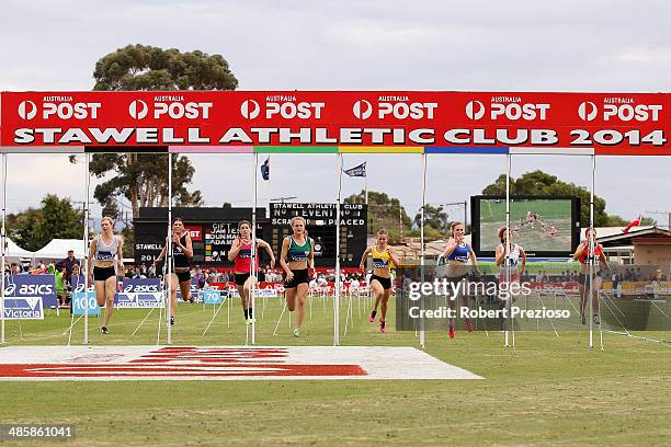 Holly Dobbyn crosses the line to win the State Victoria Strickland Family Women's Gift 120 Metres Final during the 2014 Stawell Gift meet at Central...