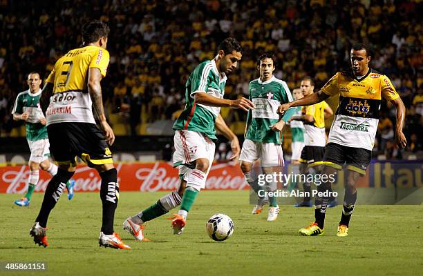 Alan Kardec of Palmeiras struggles for the ball with players of Criciuma during a match between Criciuma and Palmeiras as part of Brazilian Serie A...