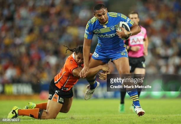 Pauli Pauli of the Eels evades is tackled by Martin Taupau of the Tigers during the round seven NRL match between the Parramatta Eels and the Wests...