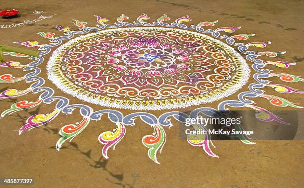 indian kolam chalk art design - rangoli stock-fotos und bilder