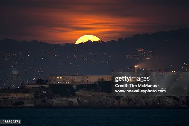 full moon rises over alcatraz - alcatraz island stock pictures, royalty-free photos & images