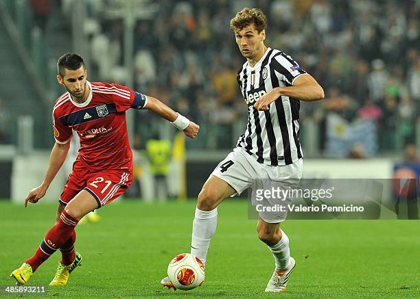 Fernando Lorente of Juventus in action against Maxime Gonalons of Olympique Lyonnais durig the UEFA Europa League quarter final match between...