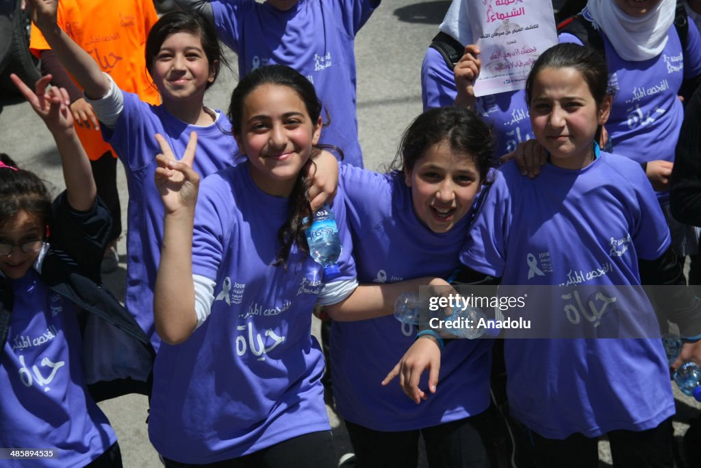 Palestinian students march in Hebron