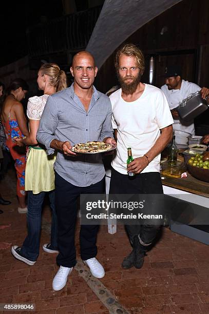Kelly Slater and Travis Lett attend Kelly Slater, John Moore and Friends Celebrate the Launch of Outerknown at Private Residence on August 29, 2015...