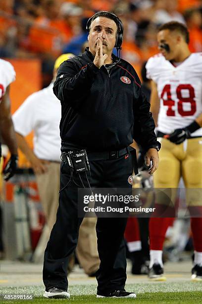 Head coach Jim Tomsula of the San Francisco 49ers leads his team against the Denver Broncos during preseason action at Sports Authority Field at Mile...