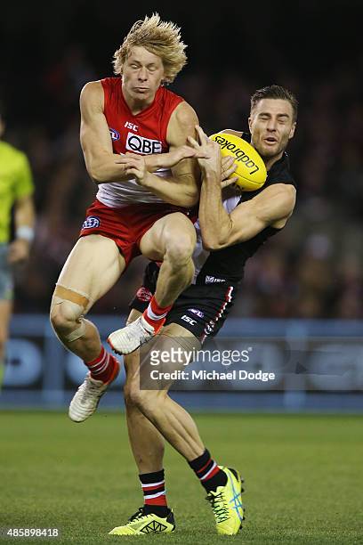 Isacc Heeney of the Swans collides into Sam Fisher of the Saints during the round 22 AFL match between the St Kilda Saints and the Sydney Swans at...