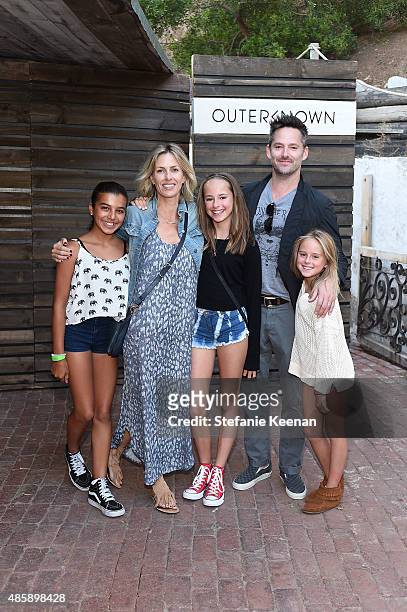 Jocelyn Cooper, Scott Cooper and children attend Kelly Slater, John Moore and Friends Celebrate the Launch of Outerknown at Private Residence on...