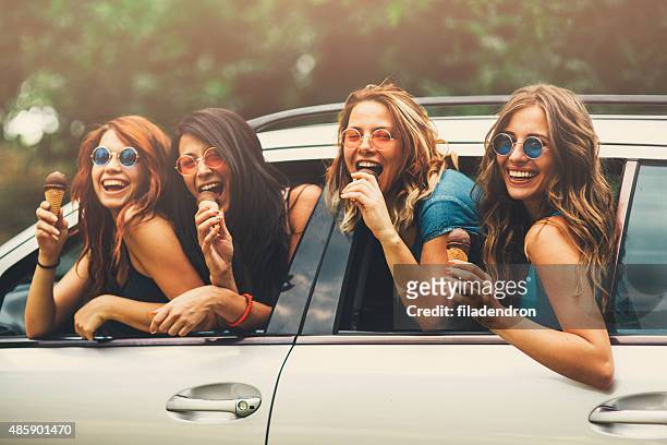 friendship - eating in car stock pictures, royalty-free photos & images