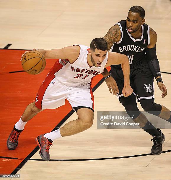 Toronto Raptors guard Greivis Vasquez heads up court passed Brooklyn Nets guard Marcus Thornton during the game. The Brooklyn Nets defeated the...