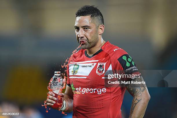 Benji Marshall of the Dragons spits his drink out after the round 25 NRL match between the Gold Coast Titans and the St George Illawarra Dragons at...