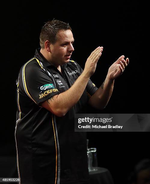 Adrian Lewis in action during the Auckland Darts Masters at The Trusts Arena on August 30, 2015 in Auckland, New Zealand.