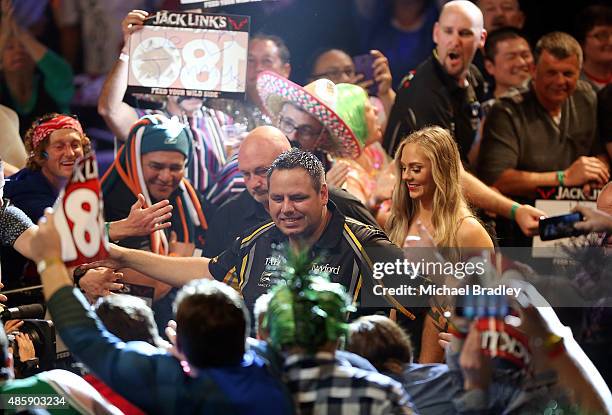 Adrian Lewis is shakes hands with the fans during the Auckland Darts Masters at The Trusts Arena on August 30, 2015 in Auckland, New Zealand.