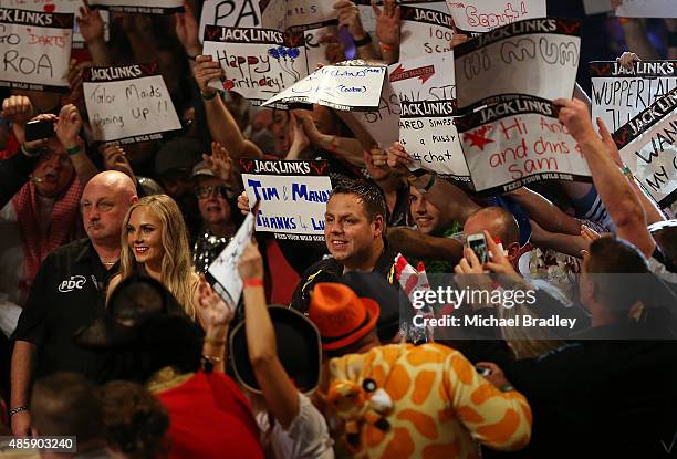 Adrian Lewis is shakes hands with the fans during the Auckland Darts Masters at The Trusts Arena on August 30, 2015 in Auckland, New Zealand.