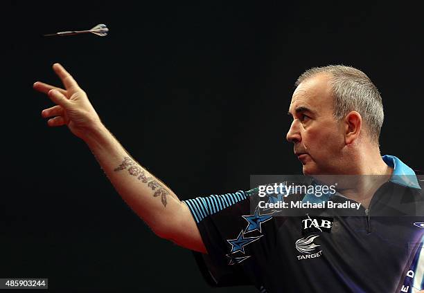 Phil Taylor in action during the Auckland Darts Masters at The Trusts Arena on August 30, 2015 in Auckland, New Zealand.