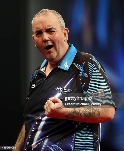 Phil Taylor reacts during during the Auckland Darts Masters at The Trusts Arena on August 30, 2015 in Auckland, New Zealand.